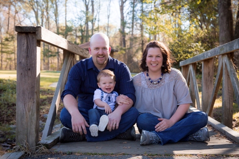 Family poses for a photo shoot at Lake Benson Park in Garner NC