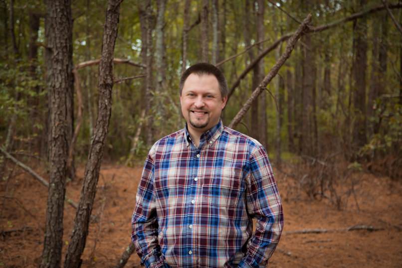 A Johnston County Dad holds his son for a photo at the local White Deer Park in Garner.